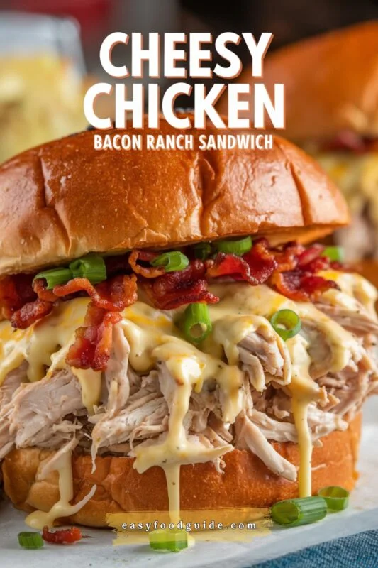 Cheesy chicken bacon ranch sandwiches on a wooden board, garnished with parsley and served with potato chips.