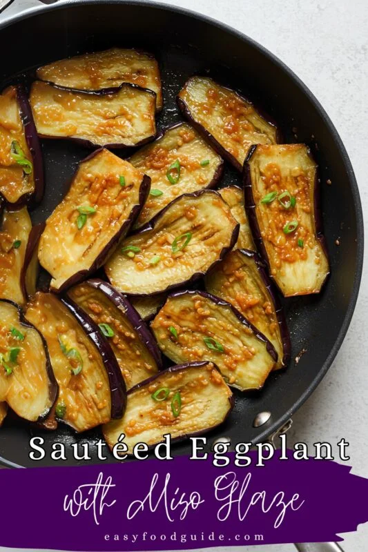 Sautéed eggplant slices with a miso glaze in a bowl.