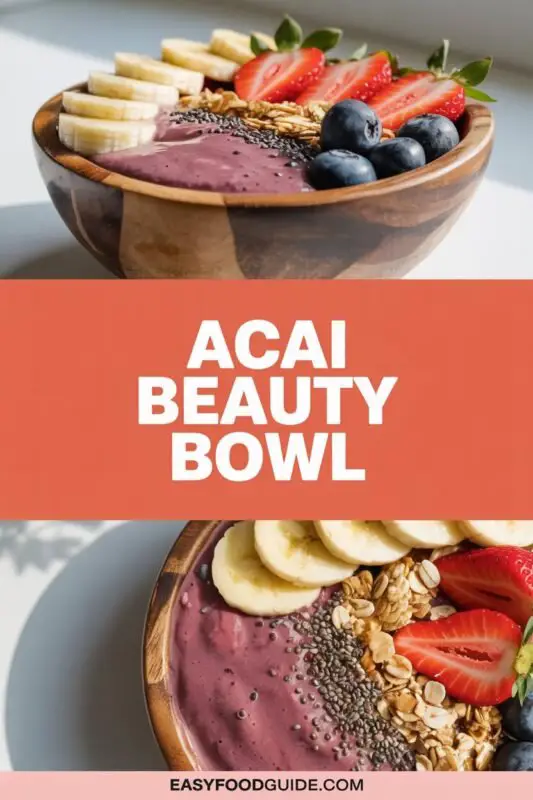 A vibrant Acai Beauty Bowl topped with fresh berries, banana slices, granola, and nut butter, set on a light wooden table.