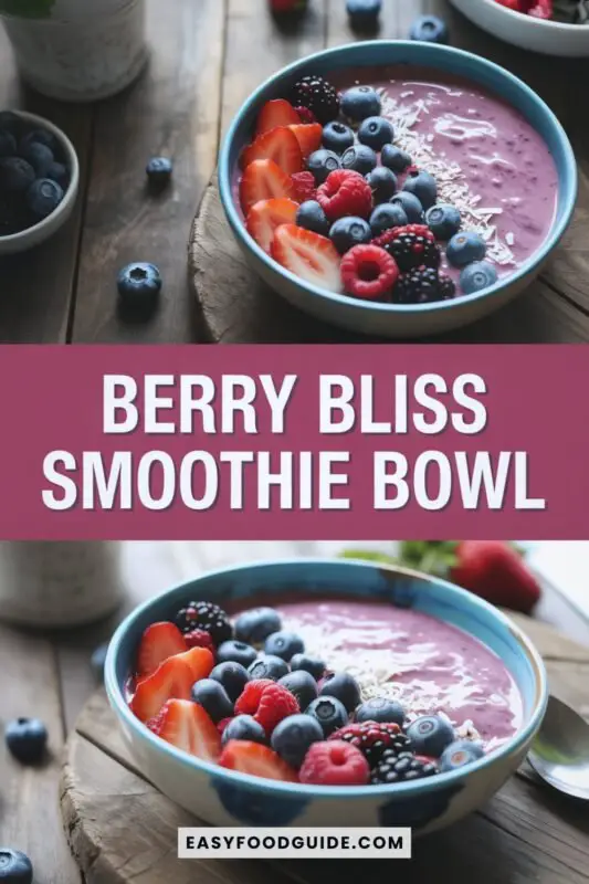 berry-smoothie-bowl-1 A colorful Berry Bliss Smoothie Bowl topped with fresh berries and coconut flakes on a rustic wooden table.