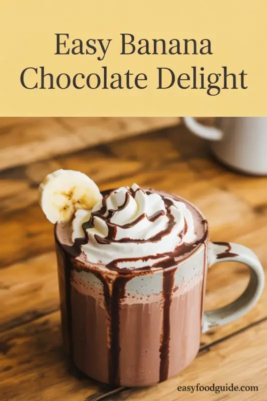 A mug of creamy Chocolate Banana Hot Chocolate with whipped cream and chocolate syrup, surrounded by banana slices and a chocolate bar.