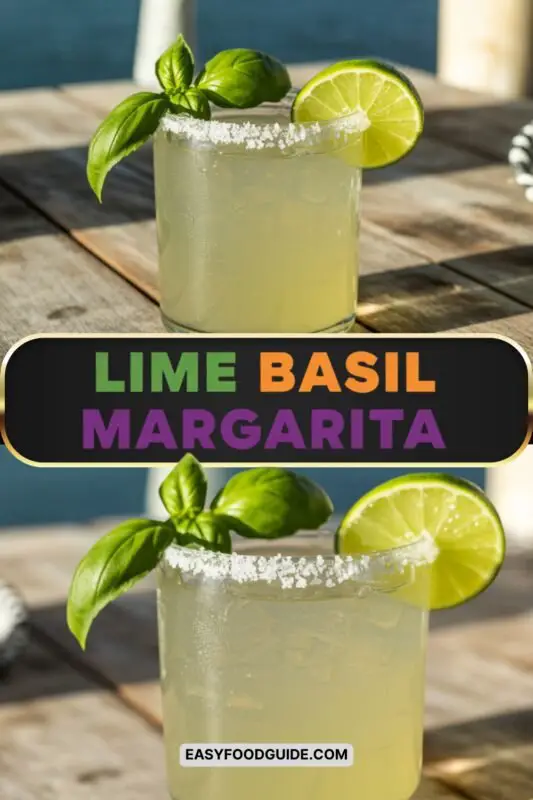 A refreshing Lime Basil Margarita in a salt-rimmed glass, garnished with lime and basil, on a wooden table.