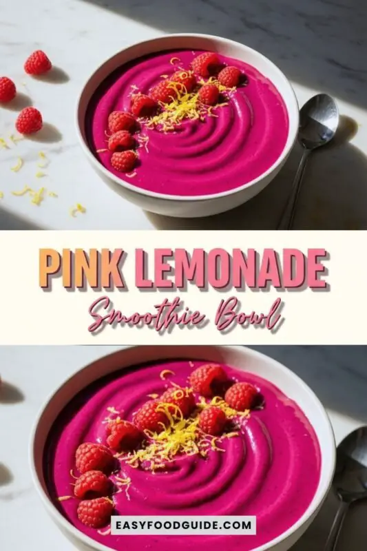 pink-lemonade-smoothie-bowl-1 A colorful pink lemonade smoothie bowl with lemon zest and raspberries, garnished with granola, perfect for summer.