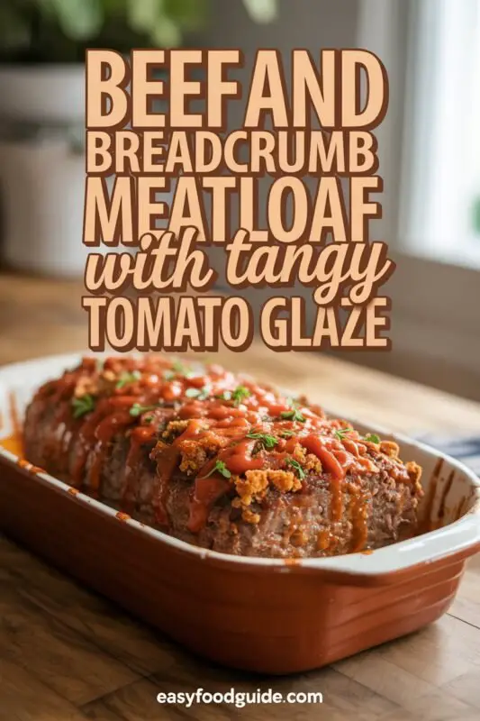 A glazed beef meatloaf on a cutting board with parsley, sliced to show juicy interior, served with mashed potatoes and green beans.
