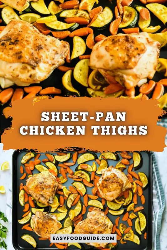 sheet-pan-chicken-thighs-1 Sheet pan with juicy roasted chicken thighs and colorful vegetables, garnished with lemon wedges and herbs.