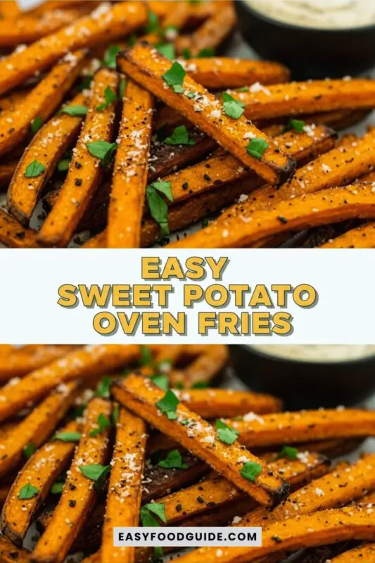Crispy baked sweet potato fries on a plate with dipping sauce, garnished with herbs.