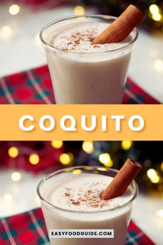 A glass of Coquito, a traditional Puerto Rican holiday drink, garnished with cinnamon, on a festive table.