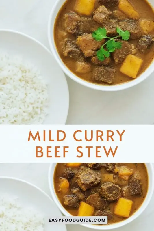 mild-curry-beef-stew-1 A bowl of mild curry beef stew with beef, potatoes, and carrots in coconut sauce, garnished with cilantro, served with rice.