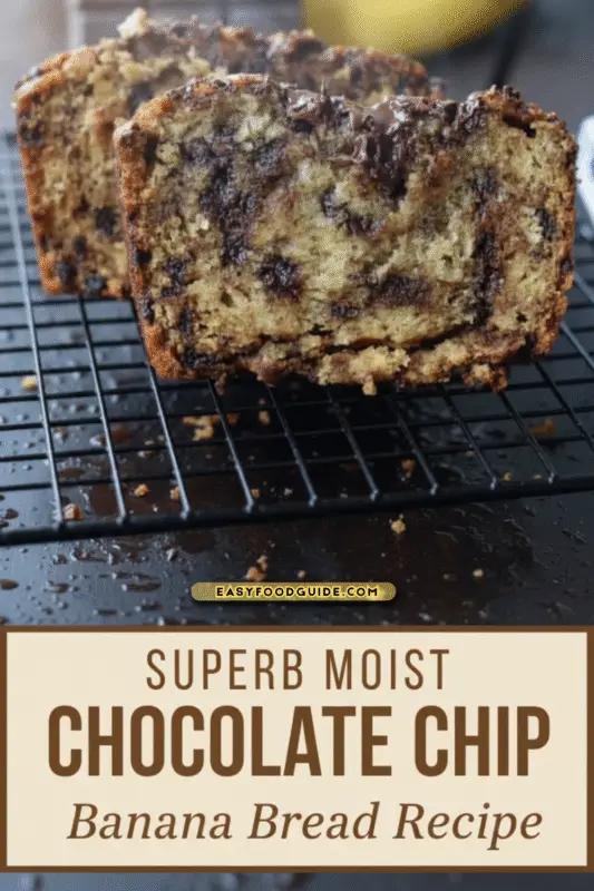 Freshly baked chocolate chip banana bread cooling on a rack, with steam rising in soft light.