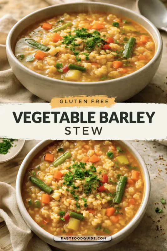 A steaming bowl of gluten-free vegetable barley stew with colorful vegetables on a wooden table.