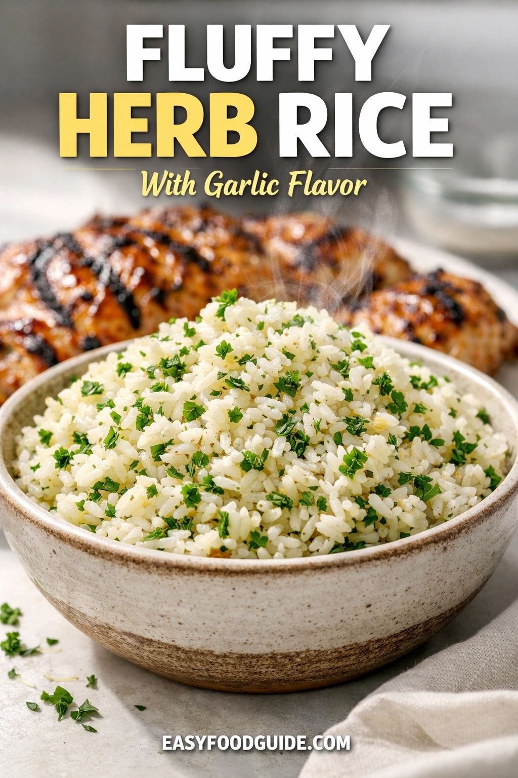 A bowl of fluffy herb rice with garlic flavor, garnished with fresh parsley. The steaming side dish is presented in a ceramic bowl, with grilled chicken visible in the background on a light surface. Text reads "FLUFFY HERB RICE With Garlic Flavor," and the website "EASYFOODGUIDE.COM" is at the bottom.