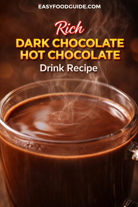 dark-chocolate-hot-chocolate-2 A close-up of a rich dark chocolate hot chocolate drink recipe, served in a clear glass mug. The steaming beverage is presented against a warm, atmospheric background. Text reads "Rich DARK CHOCOLATE HOT CHOCOLATE Drink Recipe," and the website "EASYFOODGUIDE.COM" is at the top.