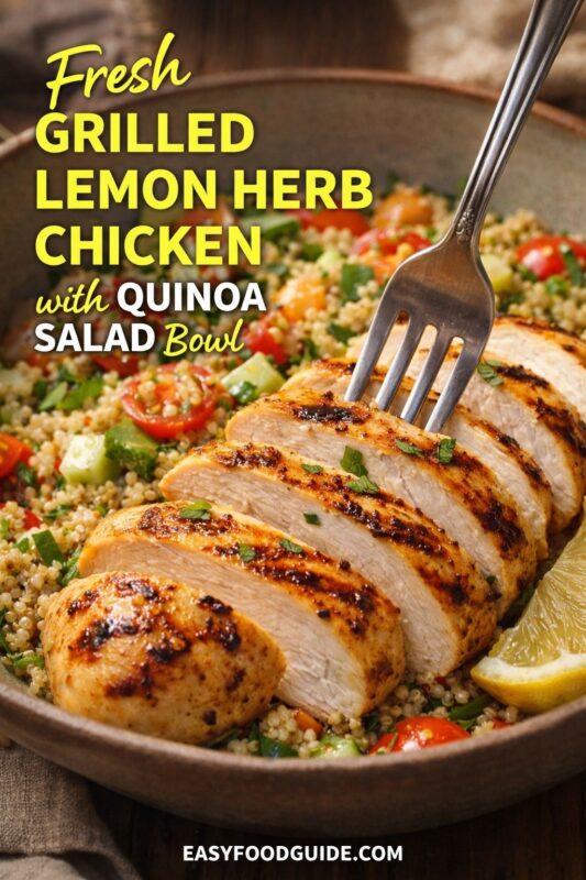 Fresh grilled lemon herb chicken: sliced, char-kissed breast atop colorful quinoa salad with tomatoes, cucumber, and herbs. Fork pierces a slice; lemon wedge on side. Text: “Fresh Grilled Lemon Herb Chicken with Quinoa Salad Bowl” + EASYFOODGUIDE.COM. Rustic bowl, warm wood table — bright, zesty, wholesome meal ready to enjoy.